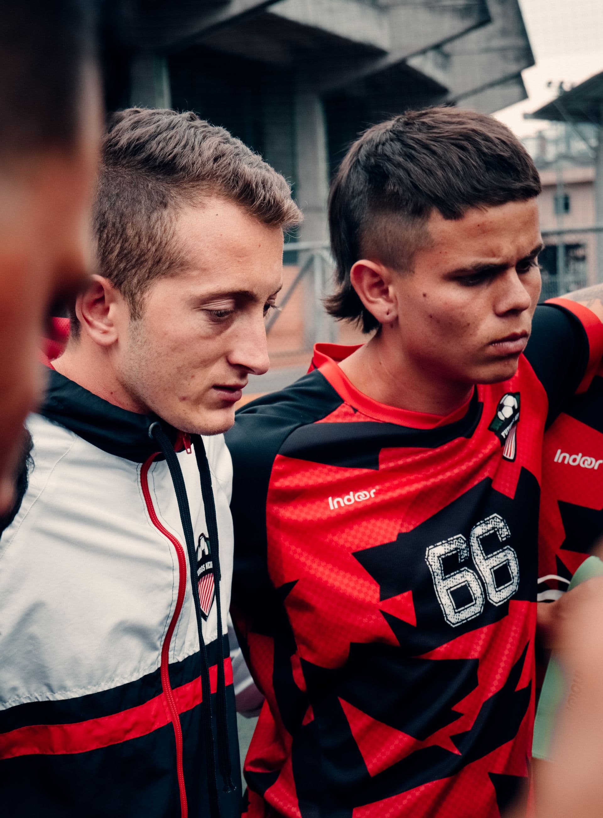 Football players in a team huddle