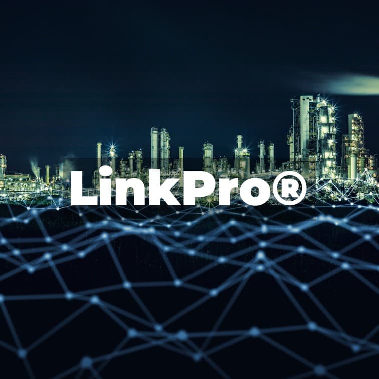 Industrial skyline at night overlaid with a digital network