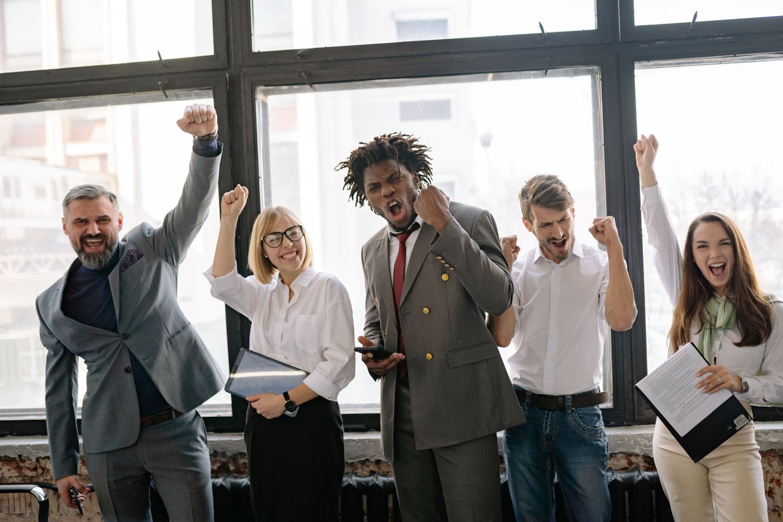 Team celebrating a win in the office