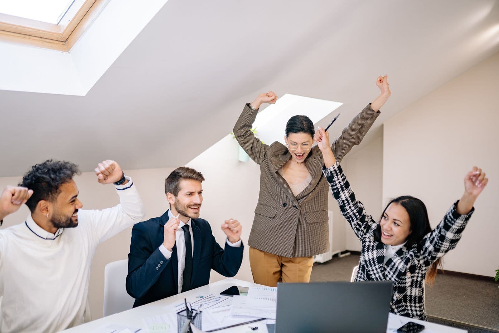 Diverse team celebrating together in an office